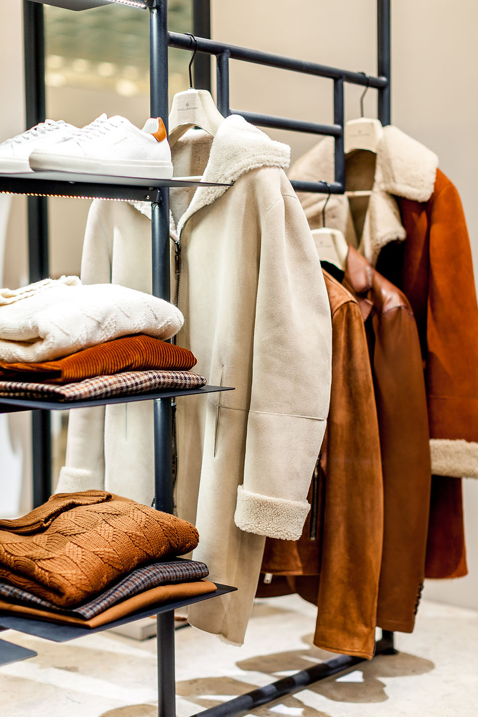 Pitti Uomo 97 Style Report Photo 6 tagliatore booth at pitti uomo showing shearling coats and knitwear
